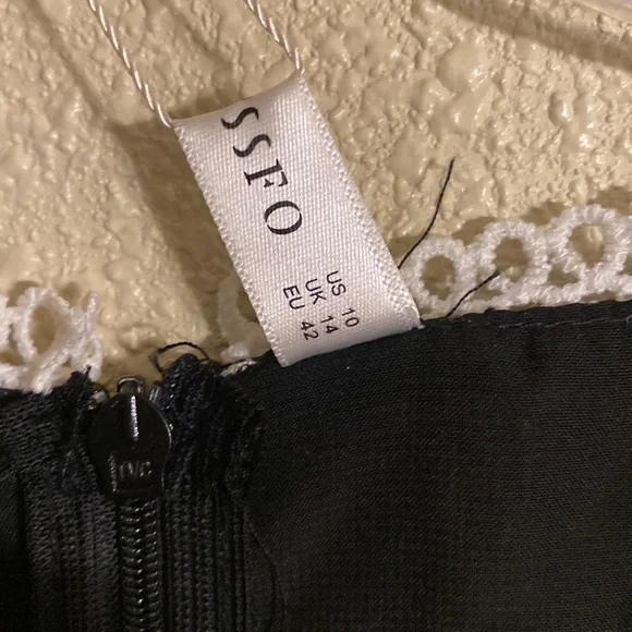 Black Dress with White Lace Cutout Sections Size 10 - Picture 6 of 13